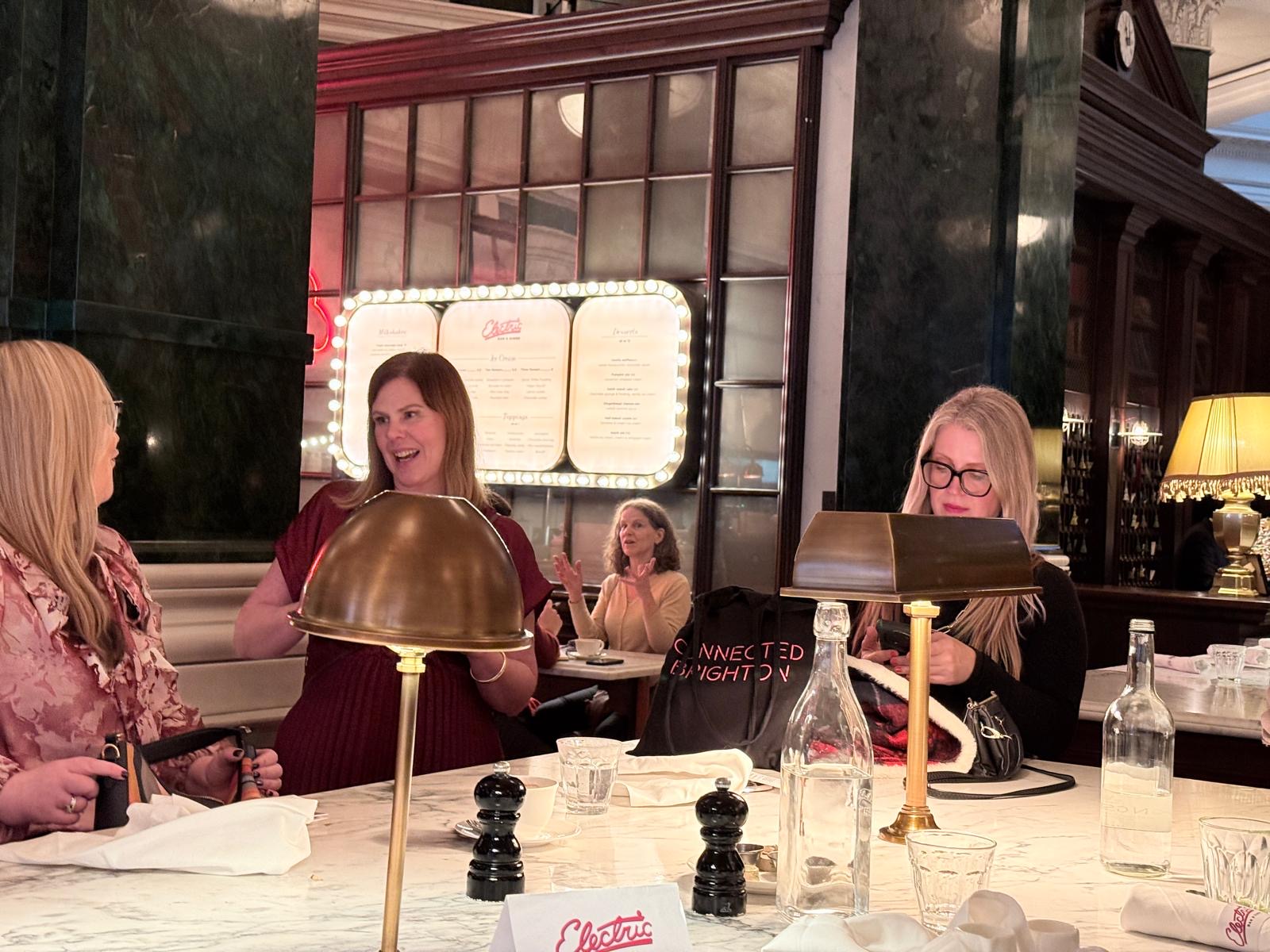 Artemis members talking together at a table